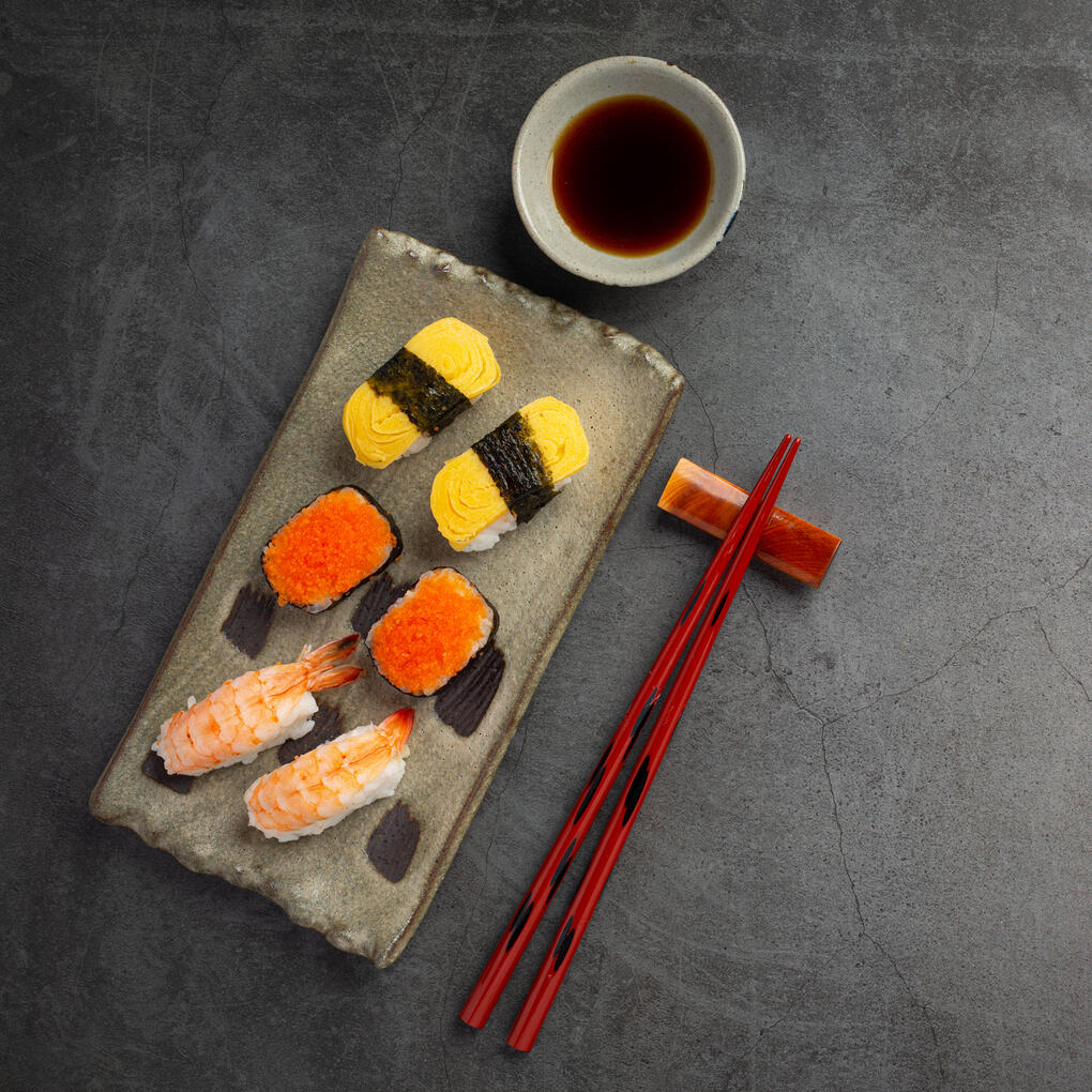 Doman Sushi An exotic dish of sweet, vinegared rice, raw fish, and marine flora prepared to stimulate not only the tongue, but the eyes.