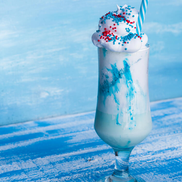 Bubbly Mogfloat A tall glass of pom fizz topped with a heaping scoop of frosty ice cream.